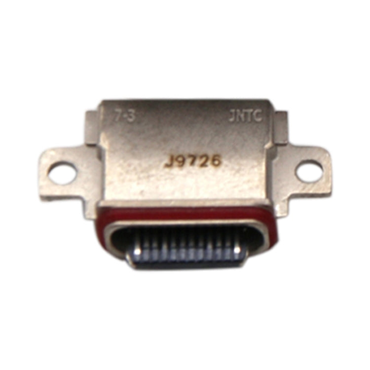 Conector del puerto de carga                ...