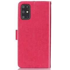 Estuche de cuero con patrón de flores prensa...